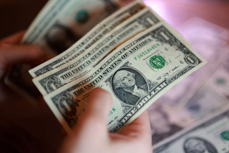 Dollar set for best month in nearly a year as bulls grow confident.