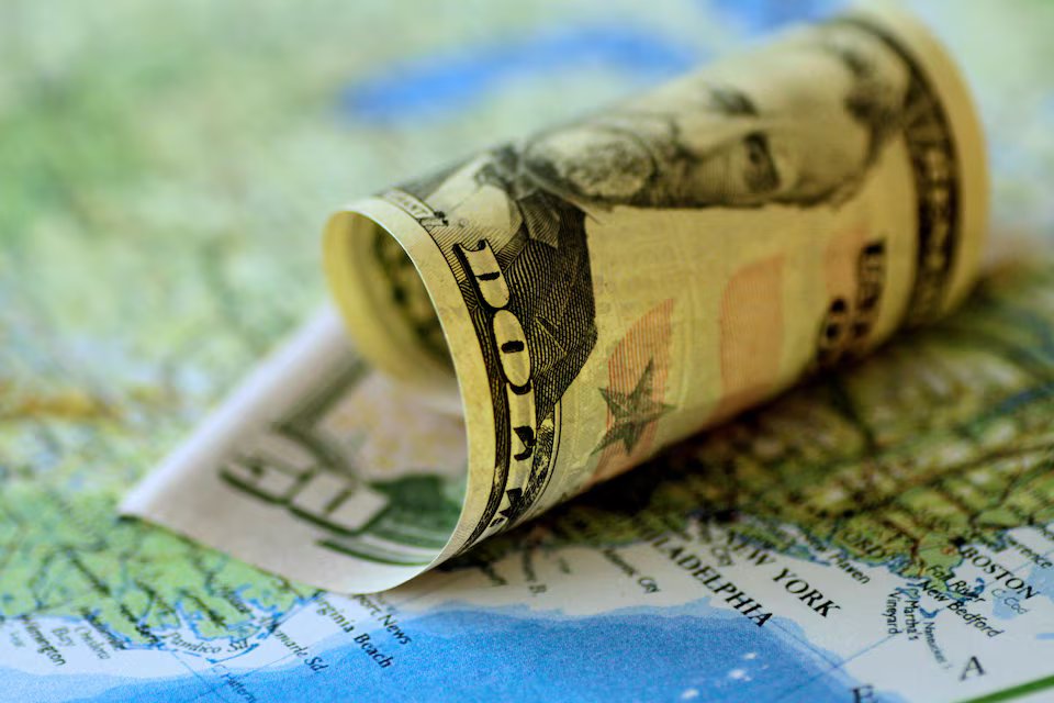 Dollar heads for weekly gain as Warsh remarks awaited.